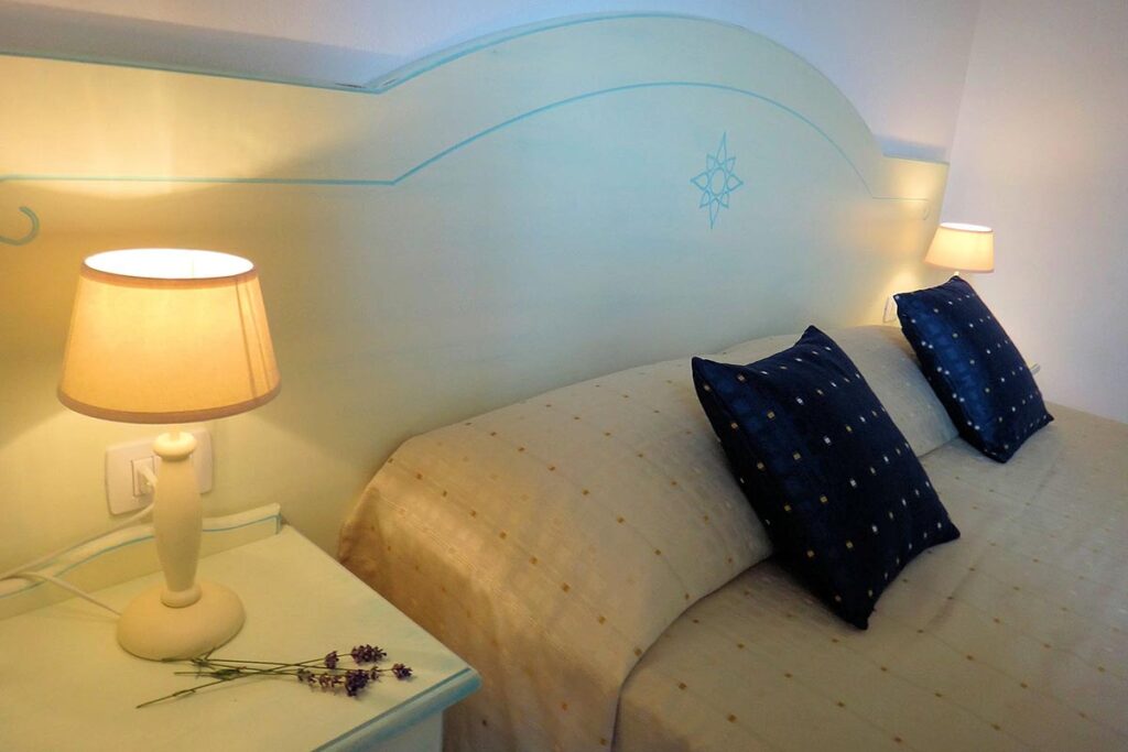 das Schlafzimmer einer Ferienwohnung Solevacanze - meer sardinien urlaub