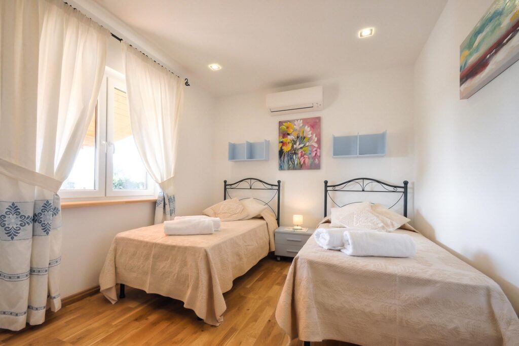 ein Doppelbettschlafzimmer des Ferienhauses Barbara, Alghero - meer sardinien urlaub
