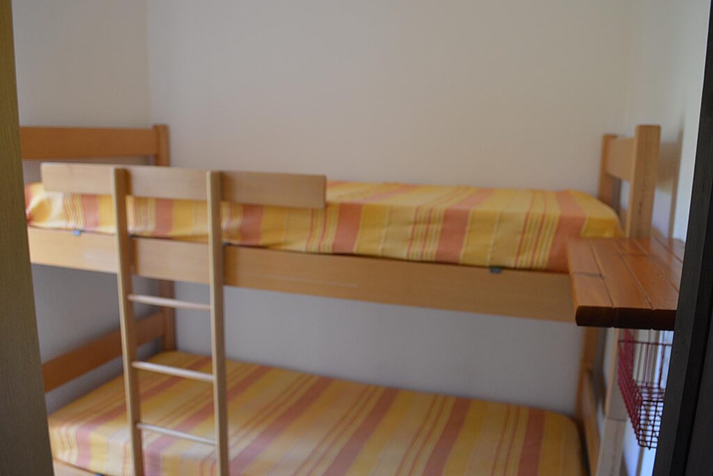 Das Schlafzimmer mit Etagenbett des Ferienhauses Turagri 135, Costa Rei - meer sardinien urlaub